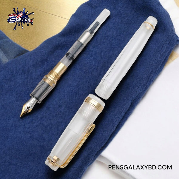 Jinhao 82 Fountain Pen - Transparent Clear - With converter on a blue jeans