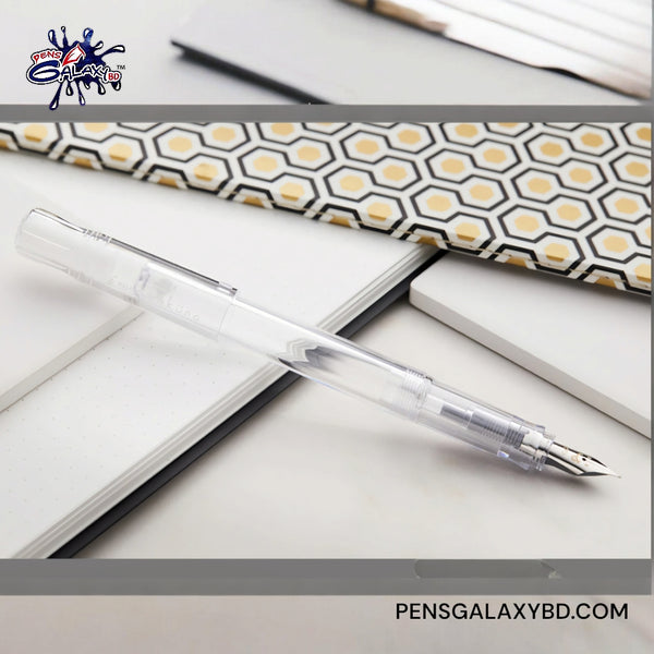 Pilot Kakuno Fountain Pen - Clear - On a white table with diaries image