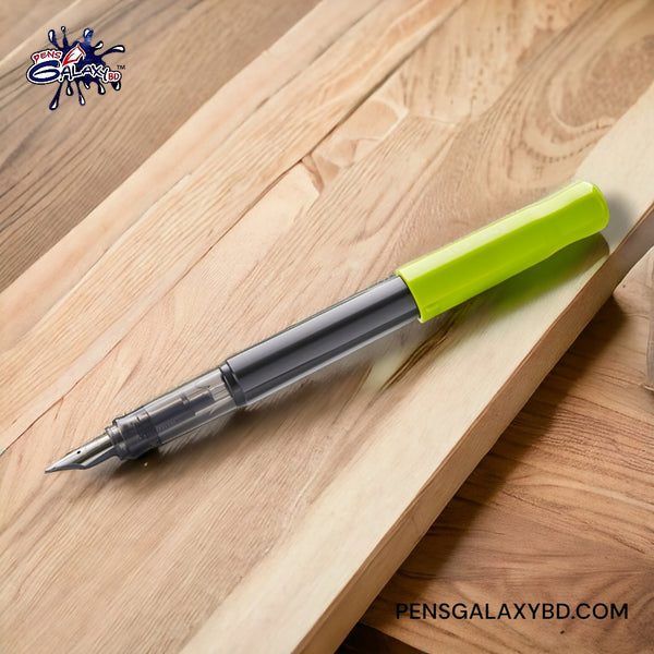 Pilot Kakuno Fountain Pen - Light Green - On a wooden desk image