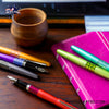 Pilot Metropolitan Fountain Pen - Retro Pop Gray - With other colors on a wooden desk