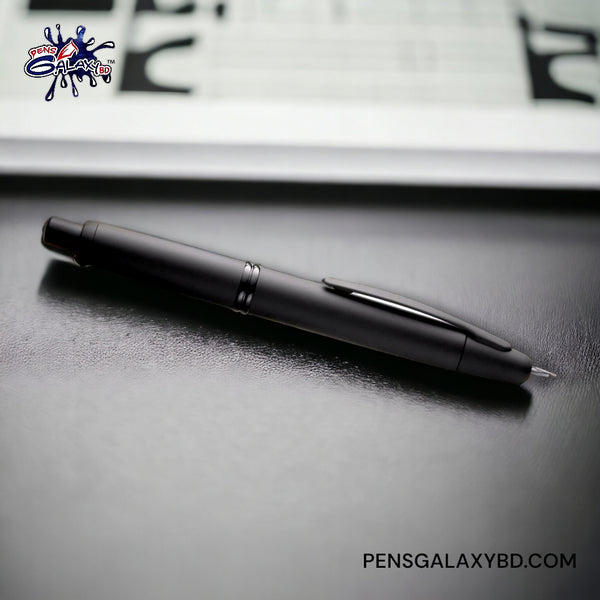 Pilot Vanishing Point Fountain Pen in Matte Black - 18K Gold - On a leather top table image