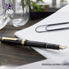 Pilot Justus 95 Fountain Pen - Black/Gold - On a wooden desk beside white paper photography