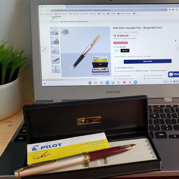 Pilot E95s Fountain Pen - Burgundy/Ivory - beside a laptop image