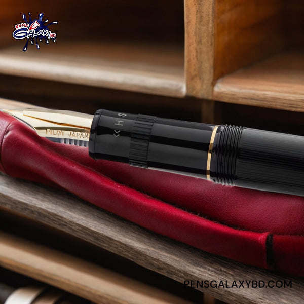 Pilot Justus 95 Fountain Pen - Black/Gold - On a leather piece image