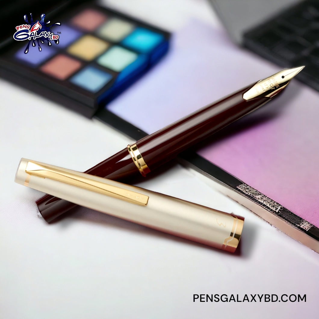 Pilot E95s Fountain Pen - Burgundy/Ivory - on a desk image