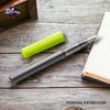 Pilot Kakuno Fountain Pen - Light Green - On a wooden desk with a diary open image