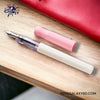 Pilot Kakuno Fountain Pen - Soft Pink - On a wooden desk image