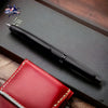 Pilot Vanishing Point Fountain Pen in Matte Black - 18K Gold - On a desk with leather pen pouch image