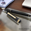 Pilot Justus 95 Fountain Pen - Black/Gold - On a wooden desk