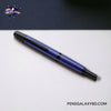 Pilot Vanishing Point Fountain Pen - Matte Blue - On a white and blue contrast desk image