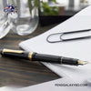 Pilot Justus 95 Fountain Pen - Black/Gold - On a wooden desk beside white paper photography 